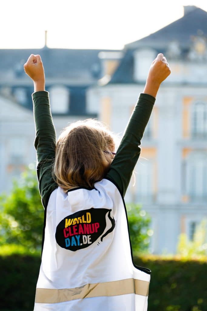 Child chearing at the World Cleanup Day by the UN.
