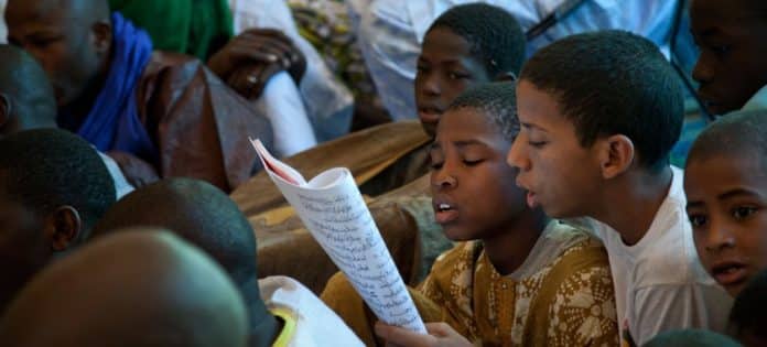 UN Photo/Marco Dormino Children reading a panegyric during a festival in Timbuktu, Mali.