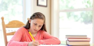 50th International Letter-Writing Competition Girl writing letter at table