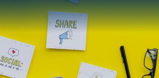 sticky notes with social media messaging on yellow wall
