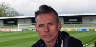 Dale Vince sitting in football stadium