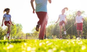 Children exercising on a pitch