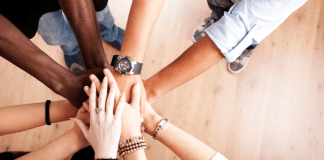 Hands stacked together showing unity. Illustrative image ahead of Summit for a new global financial pact