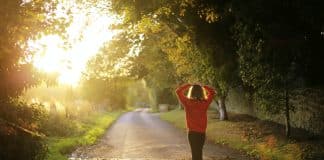 Person walking at sunrise