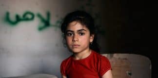 Tabarak, 6, Iraq. Tabarak lives in the war-torn western district in the old city of Mosul. She sits in an empty classroom at Al-Ekhlas primary school in the Nabi Jarjis neighbourhood.