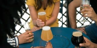 People sharing beers.