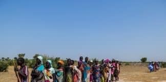 Women queue to register for aid materials at a distribution centre run by Norwegian Refugee Council (NRC) in South-Sudan.