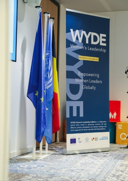 UN, EU, Belgium flags along with the WYDE banner
