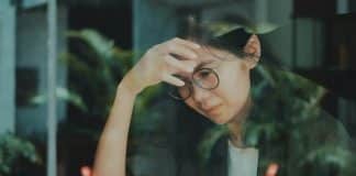 person focusing on work but looking concerned