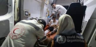 Injured child being provided with care in occupied Palestinian territories. © WHO