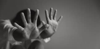 women holding her hands out in protection