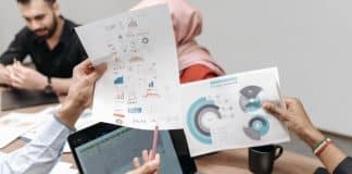 people holding infographics