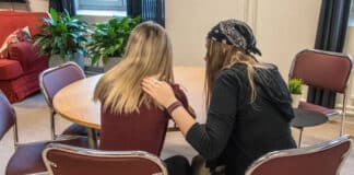 A woman comforting a girl