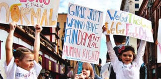 Girls demonstrating with placards