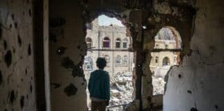 2.) A boy stands in the damaged interior of a building close to the active frontline in Taiz, Yemen. (file) Photo: UNOCHA/Giles Clarke