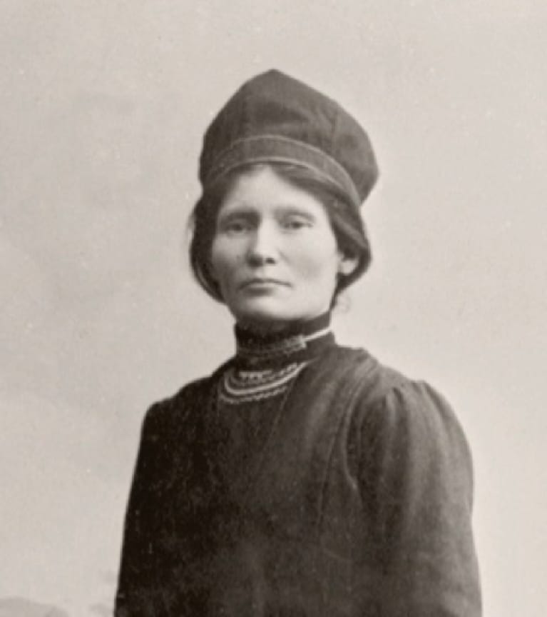 A black and white portrait of a woman