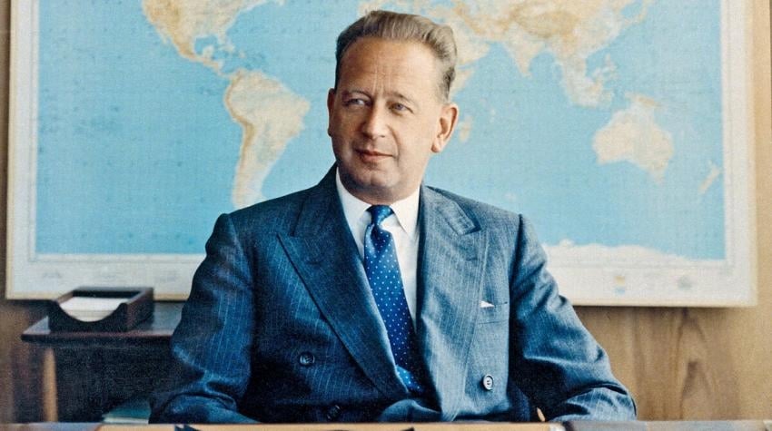 A portrait of a man sitting at a desk
