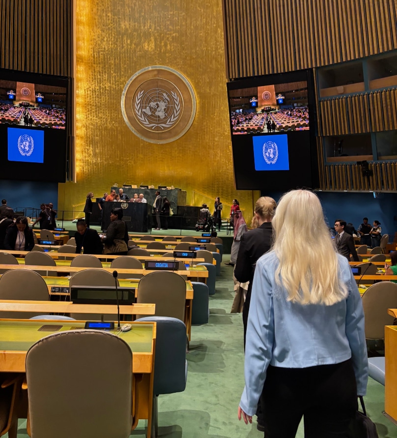 A woman in a a large meeting space