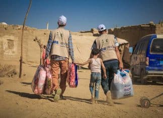 Displaced families in Marib, Yemen, receive a winterization aid package, March 2020.