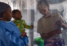 A plastic sheet separates a mother from her son at an Ebola treatment centre in North Kivu province, eastern DRC.