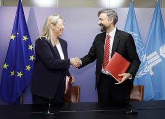 Jutta Urpilainen and Alvaro Lario shaking hands