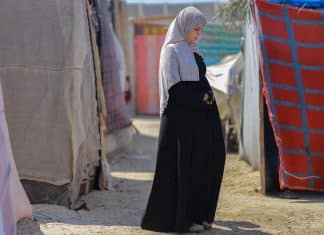 A pregnant displaced woman lives in a tent inside the Deir al-Balah camps. Credits: UNFPA